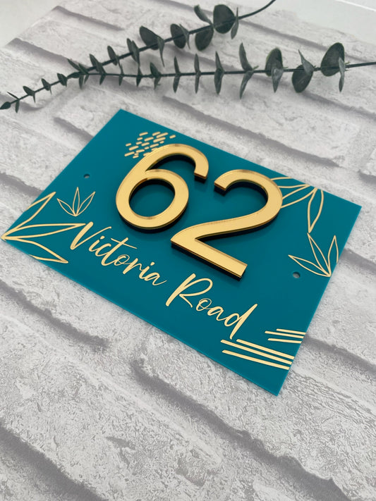turquoise acrylic house sign with gold design and 3D numbers