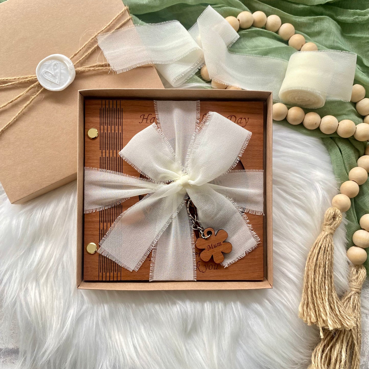 Luxury wooden Mother's Day card wrapped in ribbon with a keychain