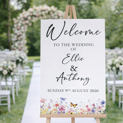 Wedding welcome sign with wildflower design at an outdoor venue